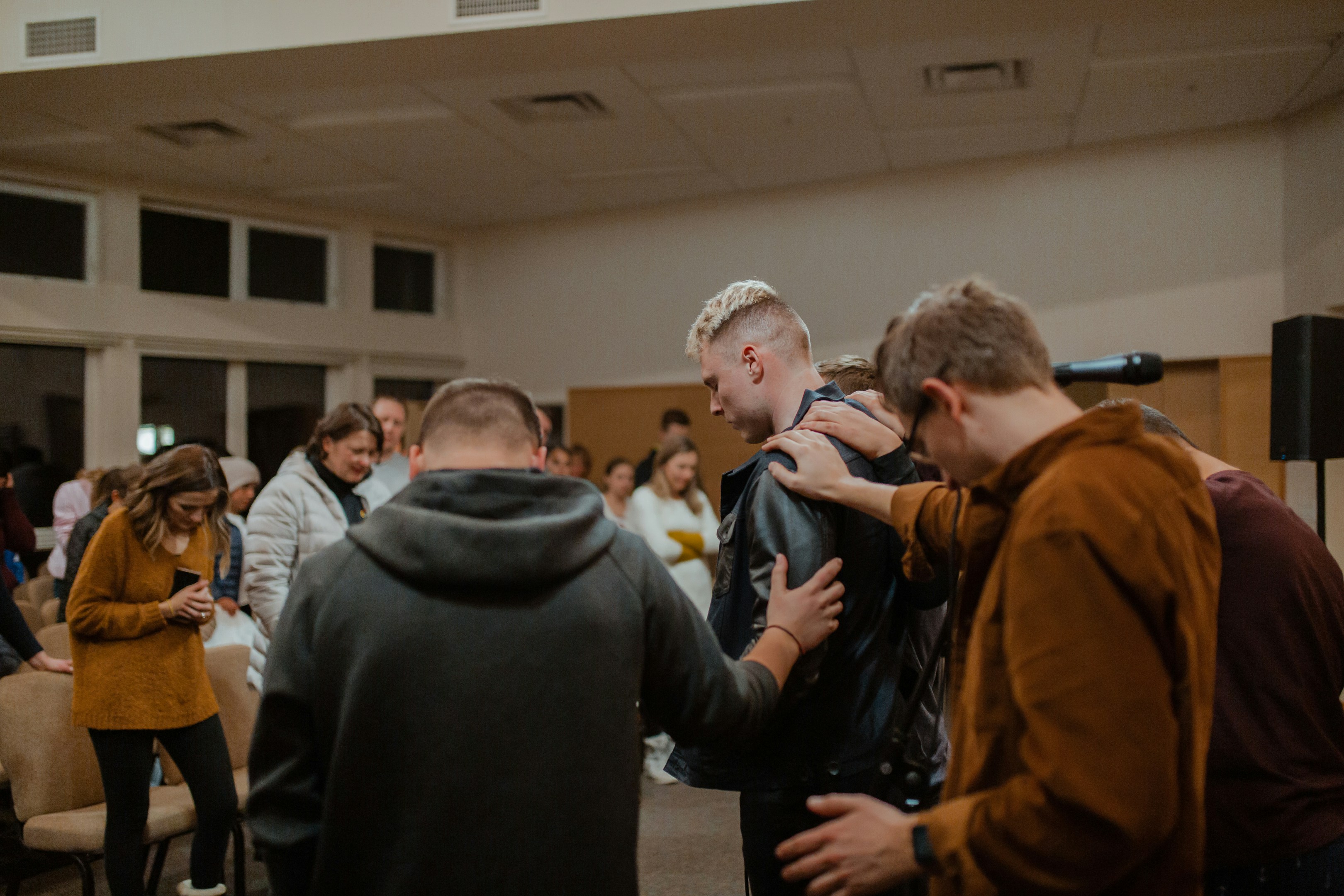 People gathered in prayer at CFC
