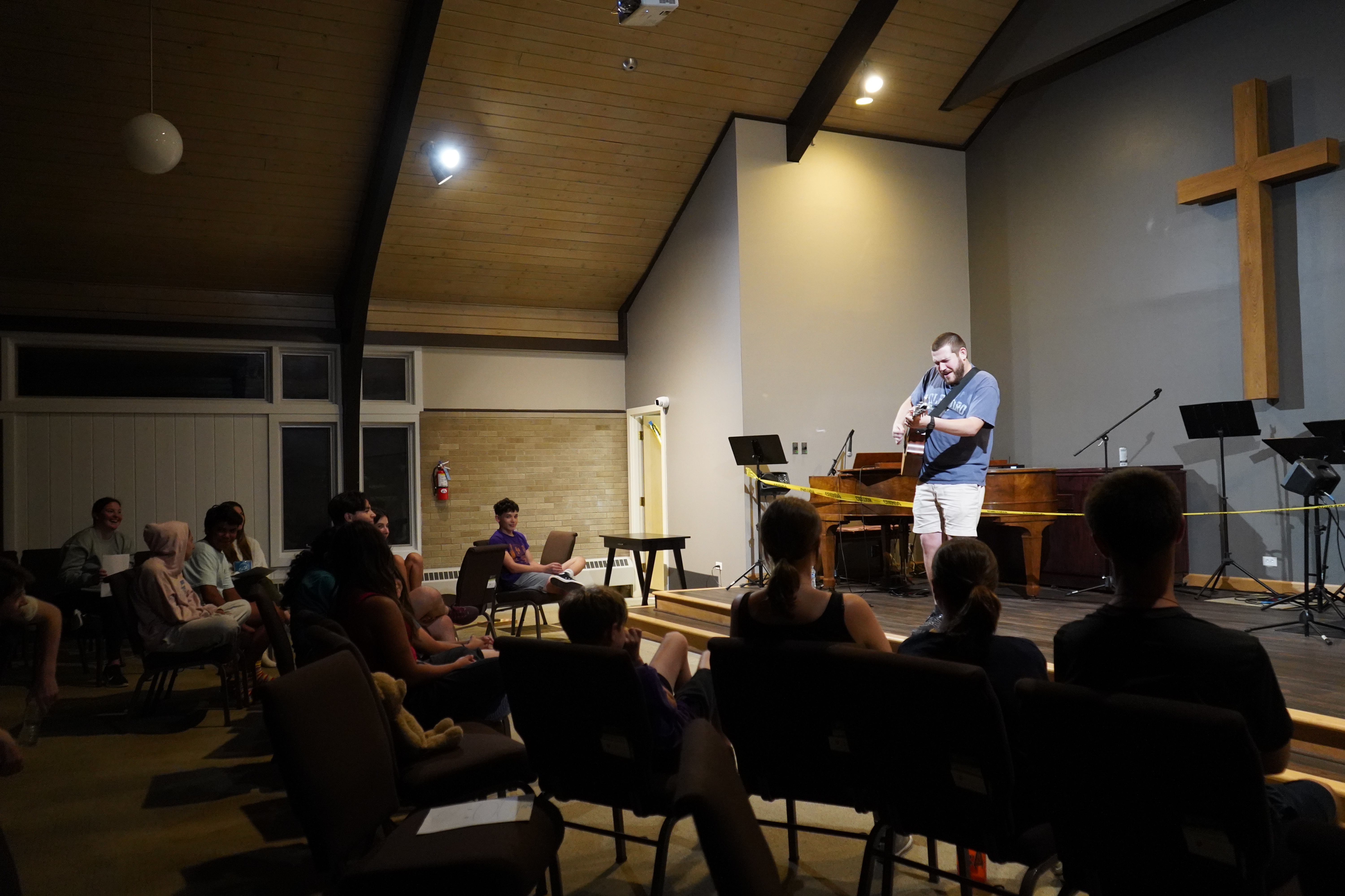 Ben Moser leading worship at youth group